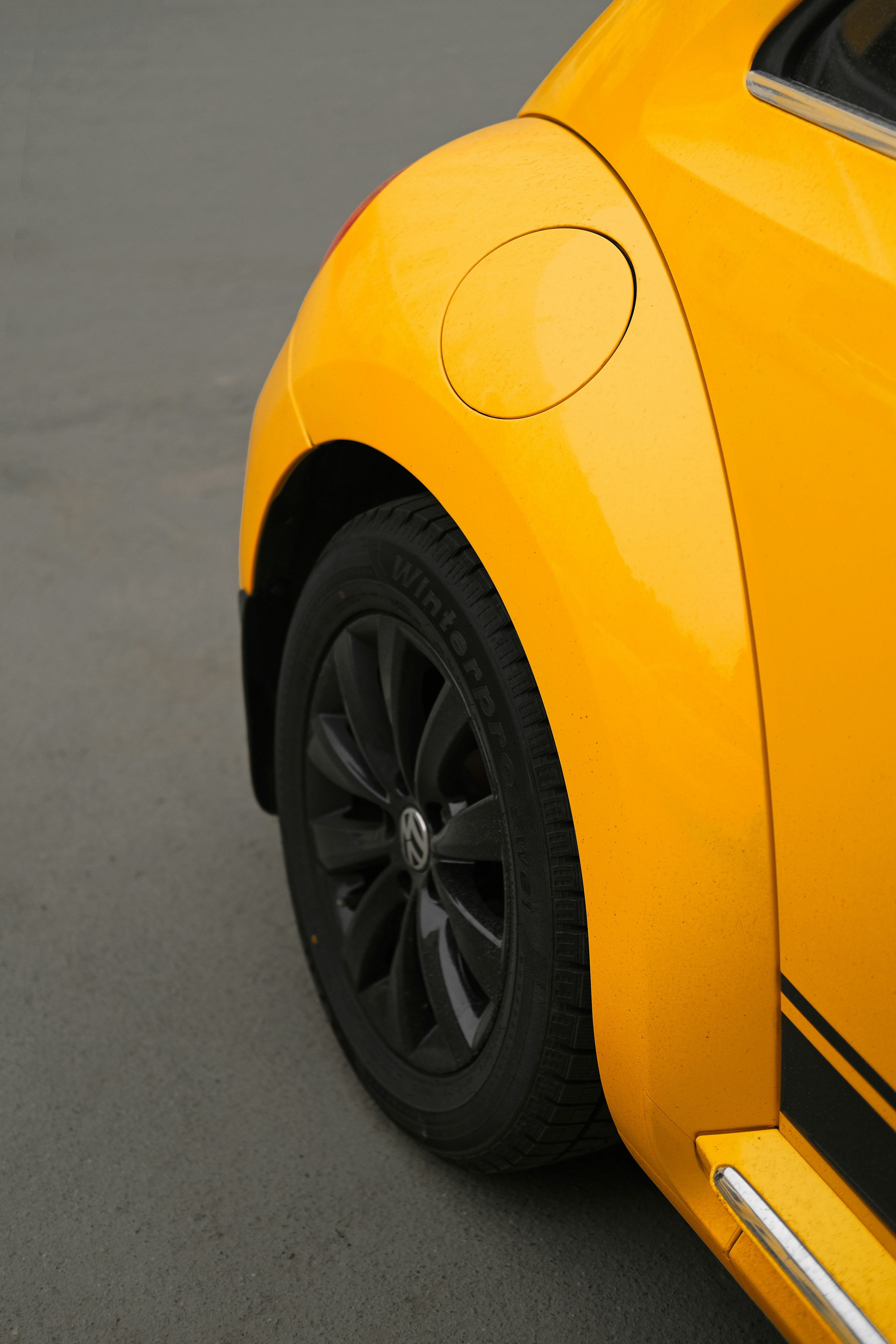 rear wheel of yellow car