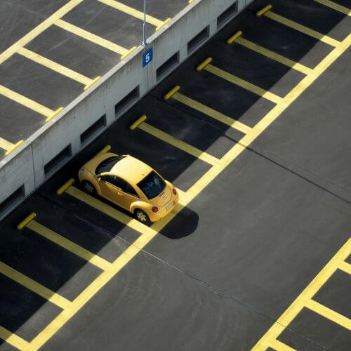 yellow buggy in empty parking lot